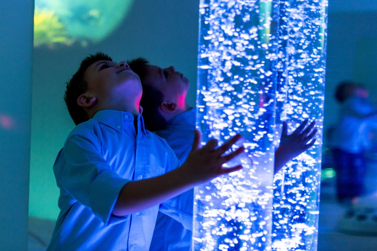 Child in therapy sensory stimulating room